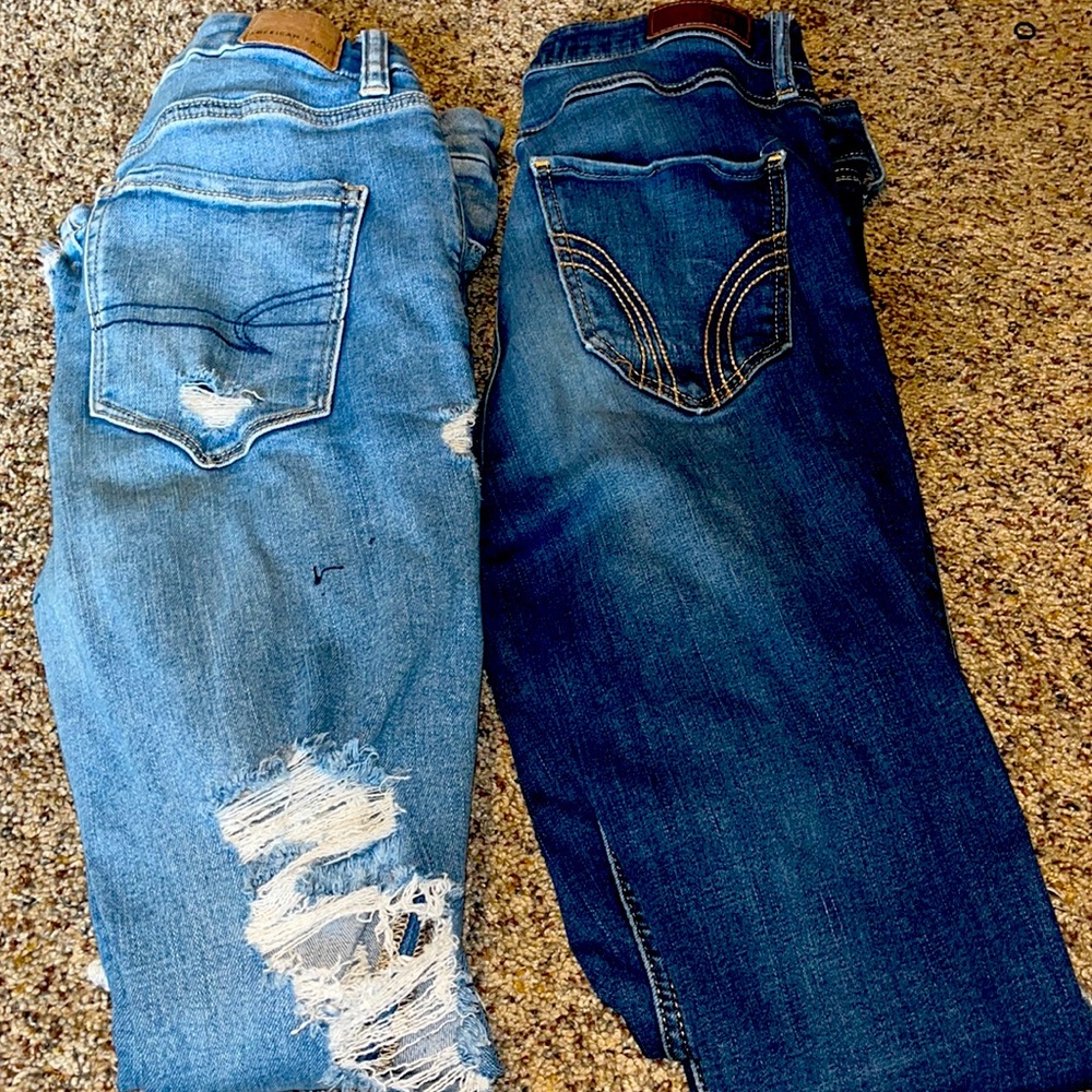 Two pairs of jeans, American eagle and holister.